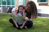 Sirine Demachkie reading to daughter Elyssa