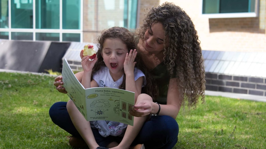 Sirine Demachkie reading to daughter Elyssa