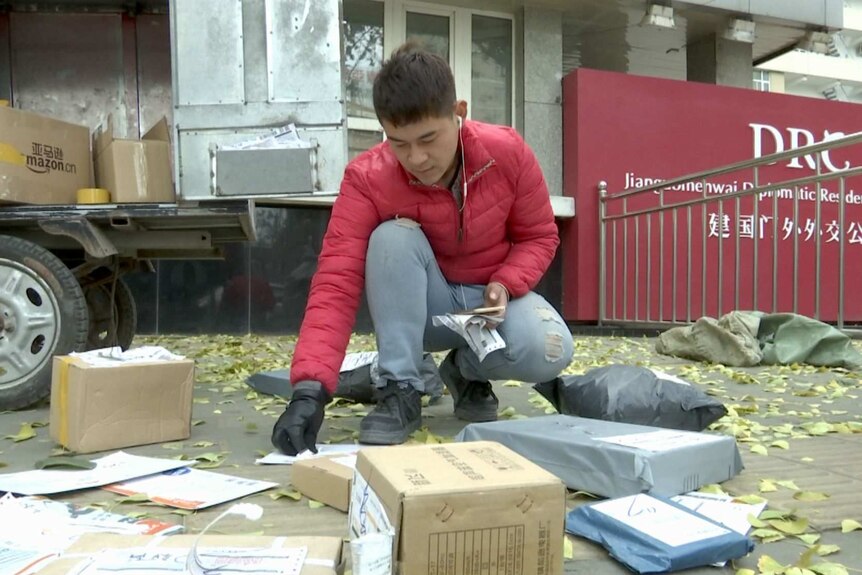 Beijing electric tricycle courier Li Wentao with parcels