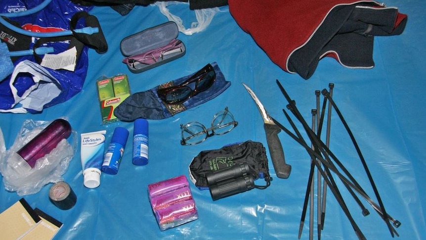 Assorted camping gear and personal items including knives, cable ties and glasses believed to belong to fugitive, Graham Potter.