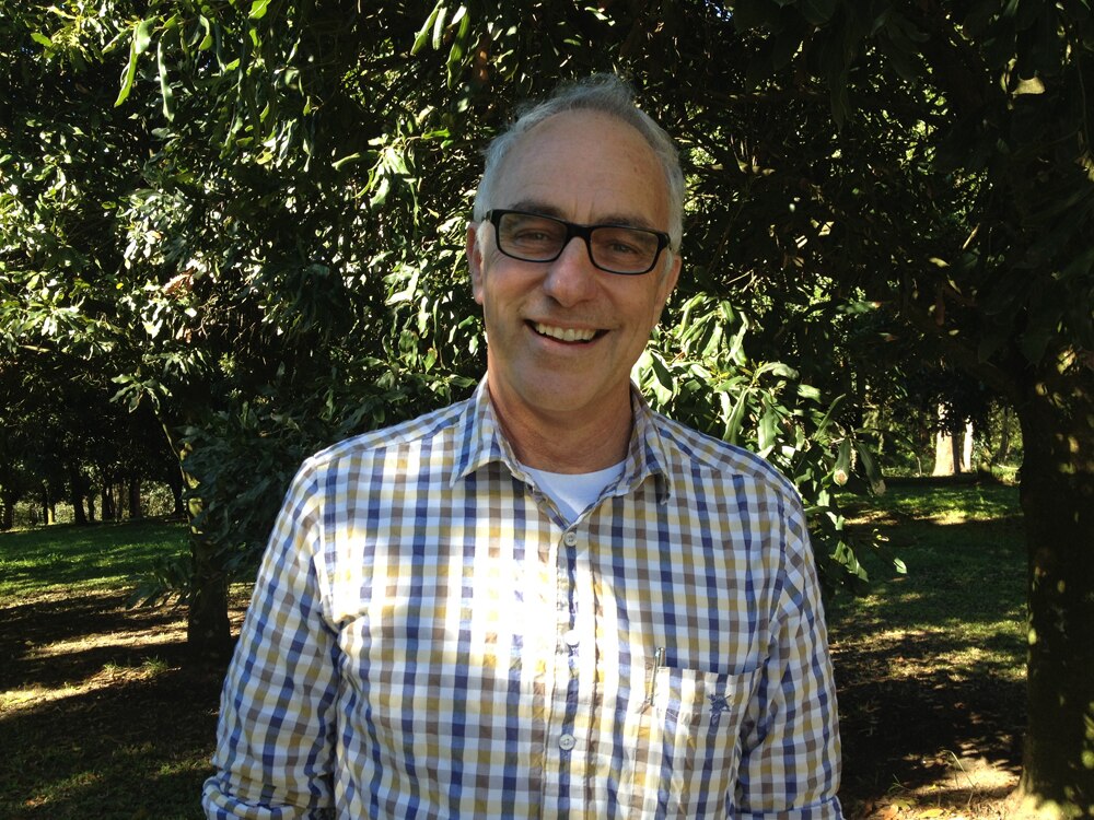 Jolyon Burnett in macadamia orchard