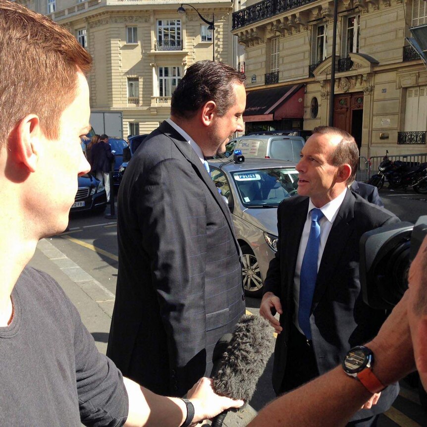Tony Abbott arrives at a Paris hotel
