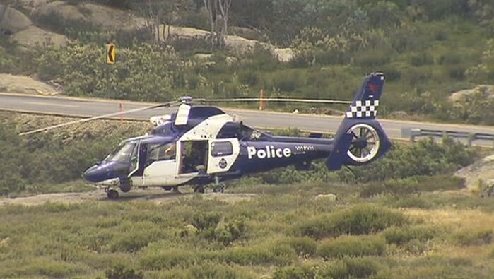 A police helicopter at Mount Buffalo where two hikers have gone missing.