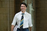 Canadian Prime Minister Justin Trudeau struts through parliament house in Ottawa