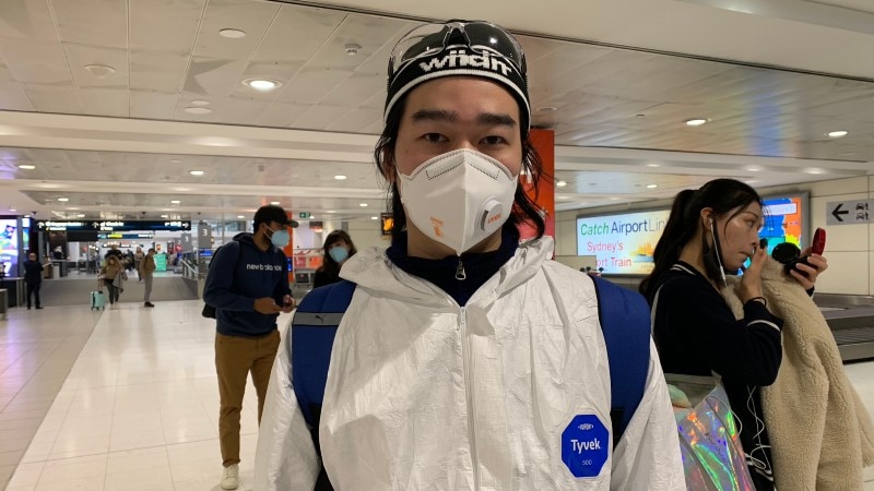 A man in full protective gear at Sydney Airport.