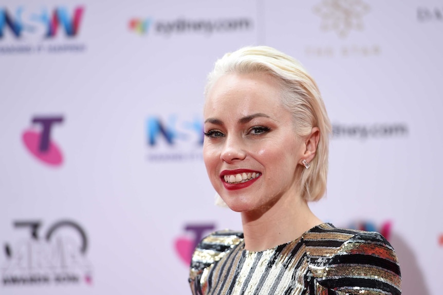 Singer Olivia Bartley smiles on the ARIA Awards red carpet.