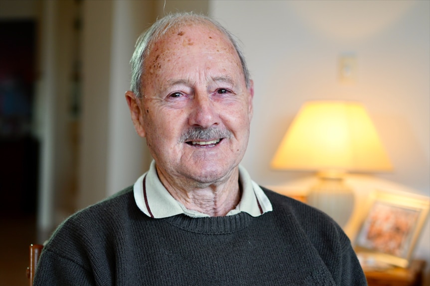 Close up shot of man with grey hair and moutache 