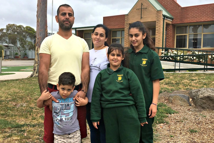 Aodisho family outside school in Melbourne