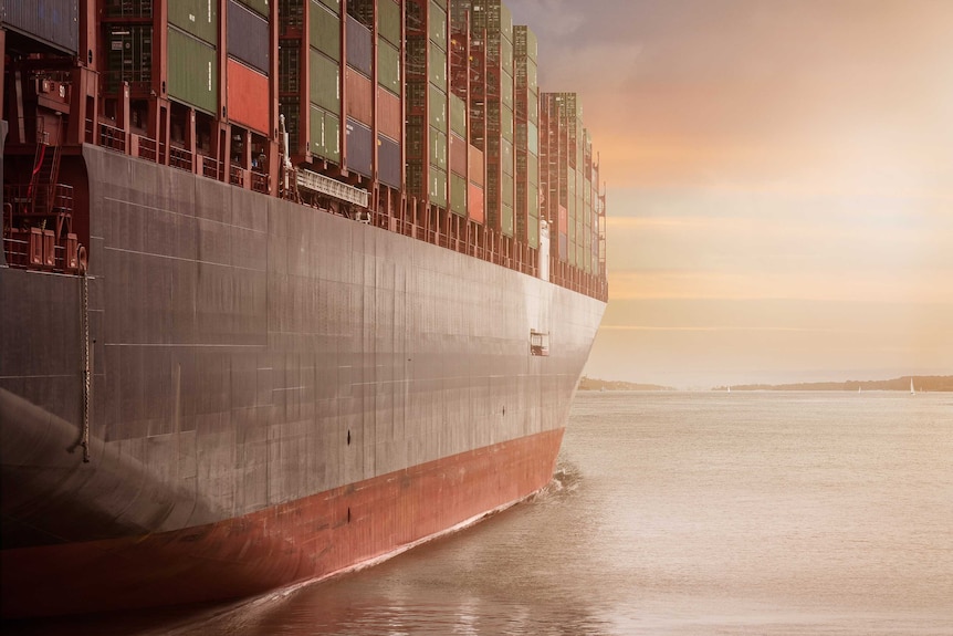 A cargo ship heading out to sea.