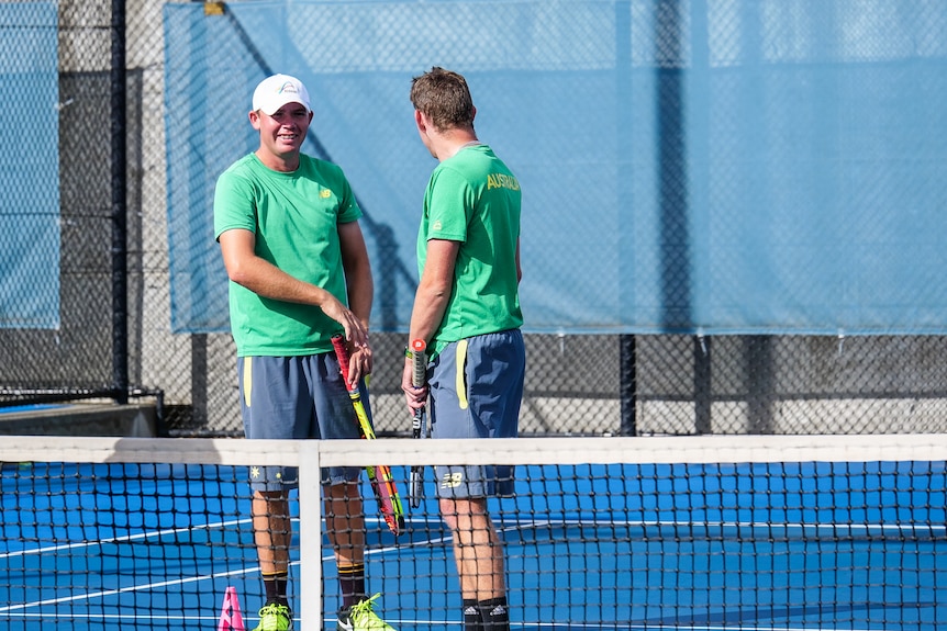 Tennis player Archie Graham and his teammate.