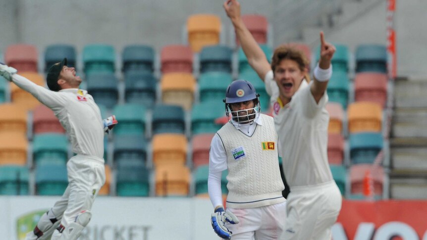 Australian bowler Shane Watson celebrates the wicket of Sri Lanka's Tillakaratne Dilshan.