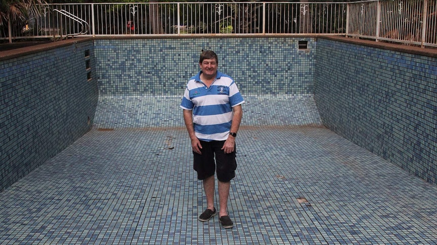 man standing in empty pool