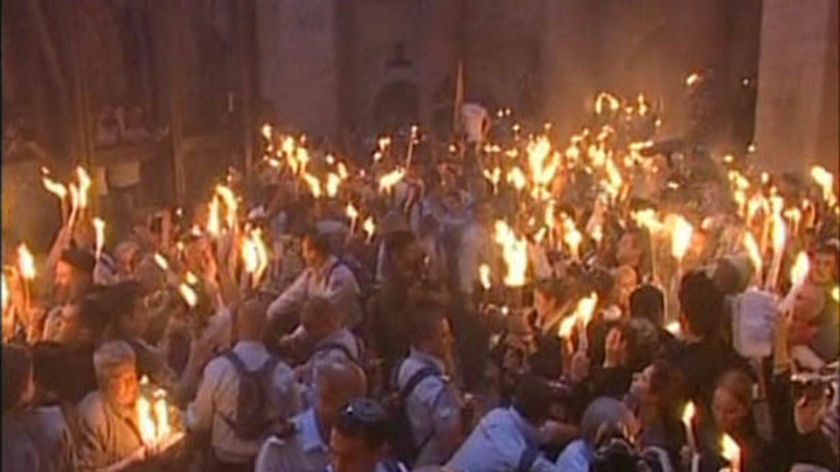 Christian pilgrims in the Church of the Holy Sepulchre witness the 'holy fire' ritual