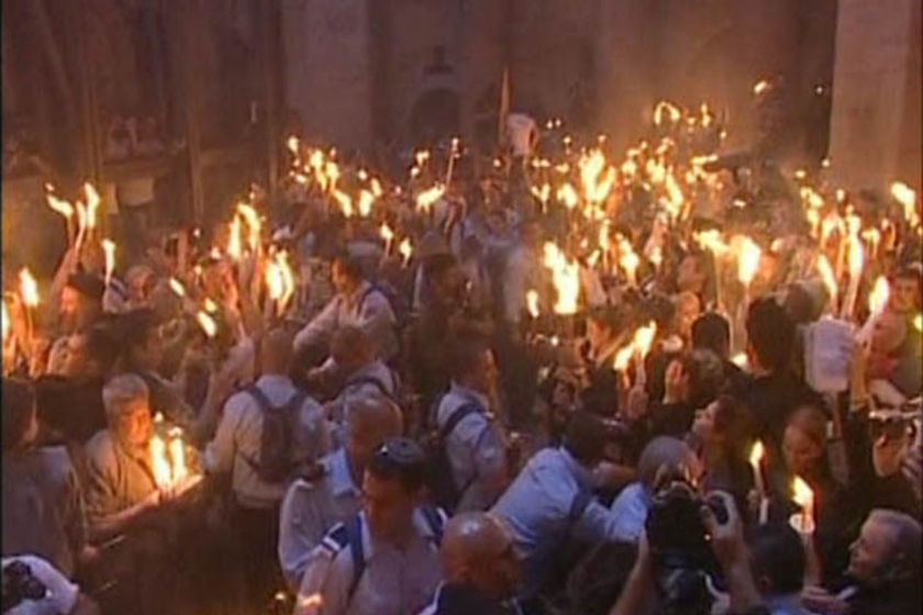 Christian pilgrims in the Church of the Holy Sepulchre witness the 'holy fire' ritual