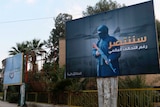islamic state militants set up billboards in syria declaring victory against coalition