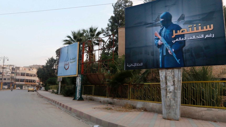 islamic state militants set up billboards in syria declaring victory against coalition