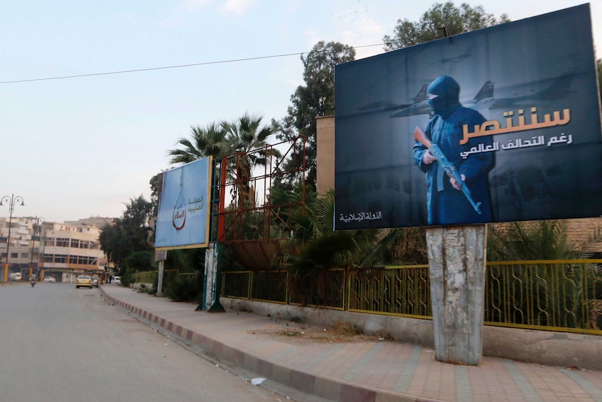 islamic state militants set up billboards in syria declaring victory against coalition