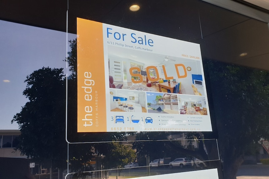 A real estate sold sign