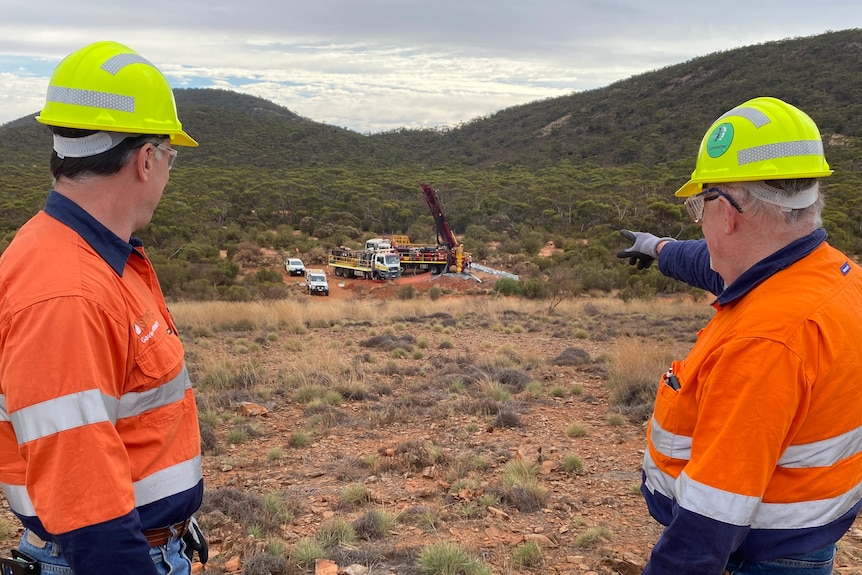 Two men in high vis vests at a mining site in remote South Australia.