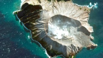 Aerial view of White Island volcano with steam coming out