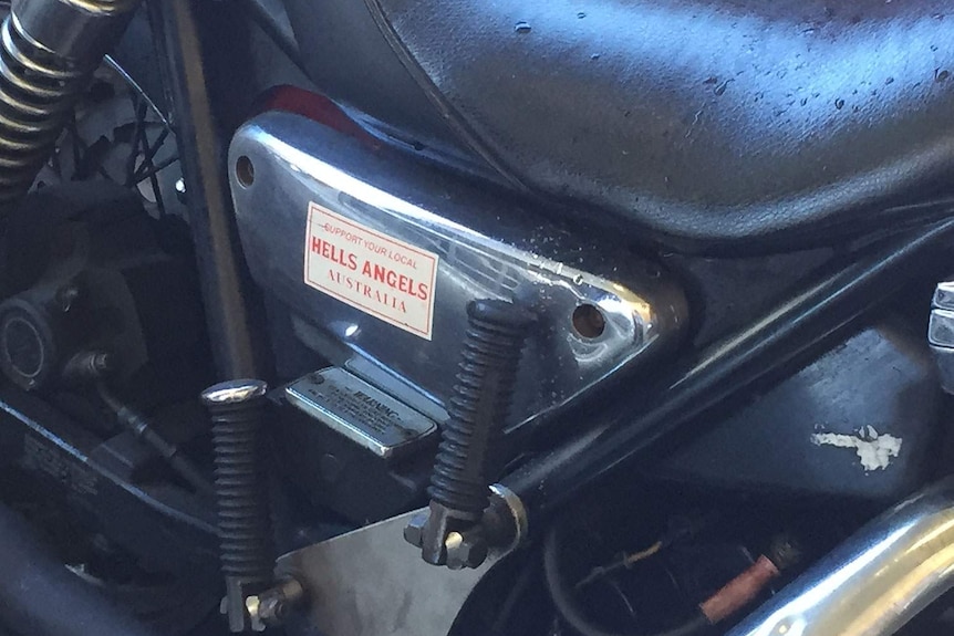 A Hells Angels badge on one of the two motorcycles seized by police
