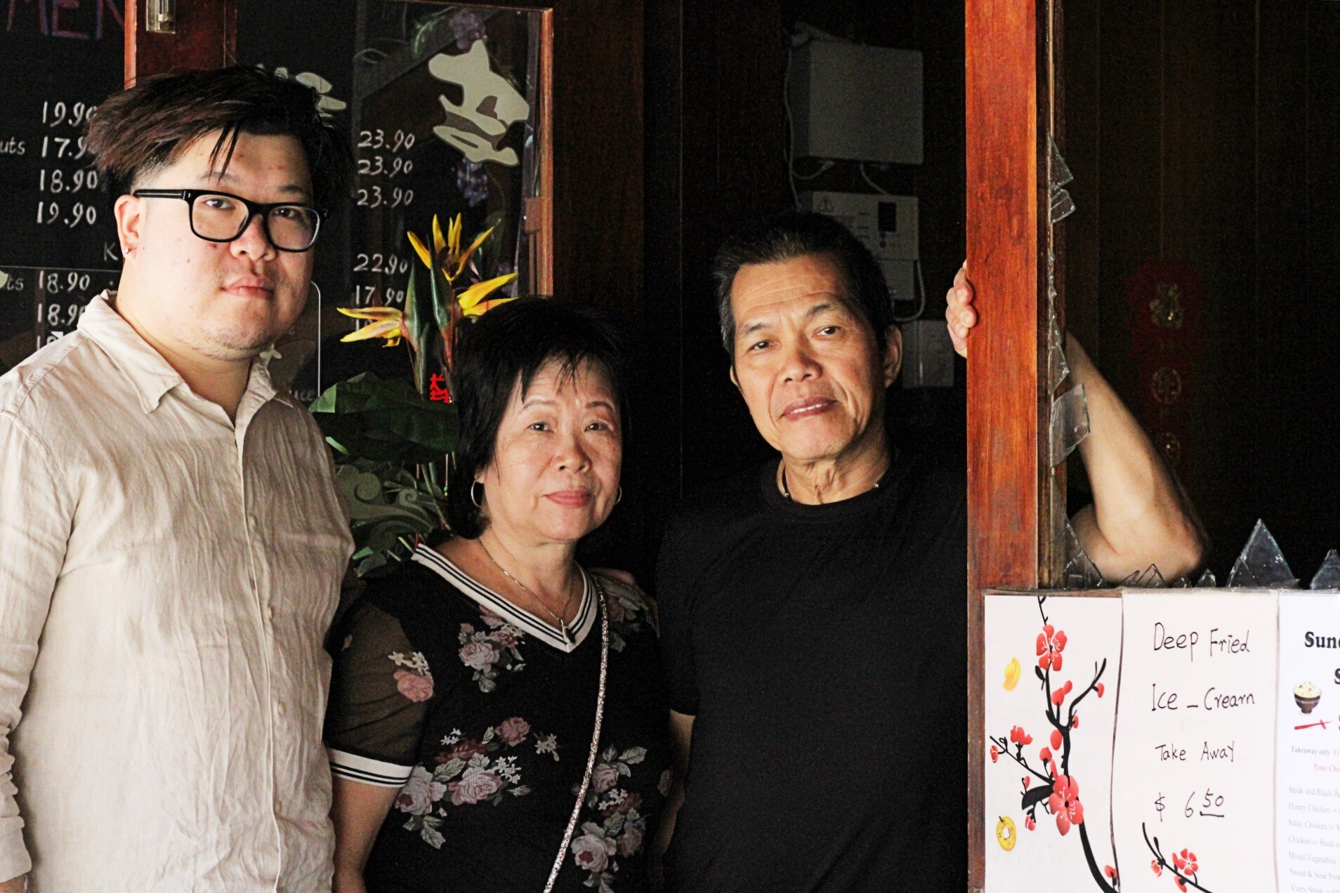 A Chinese Australia family, in their burnt out restaurant