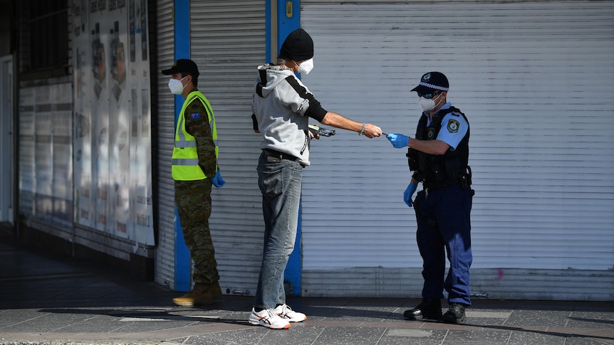 police checking a man's identity