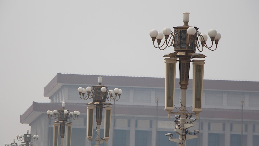 Tiananmen Square security cameras near Mao's photo at the Forbidden City
