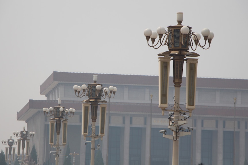 Tiananmen Square security camera's near Mao's photo at the forbidden city