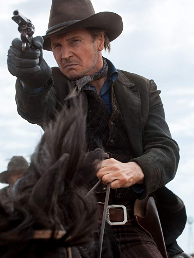 Liam Neeson on a horse.