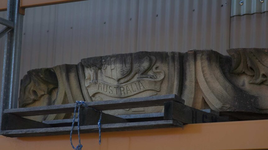 A sandstone block featuring the Australian emblems from Sydney Hospital