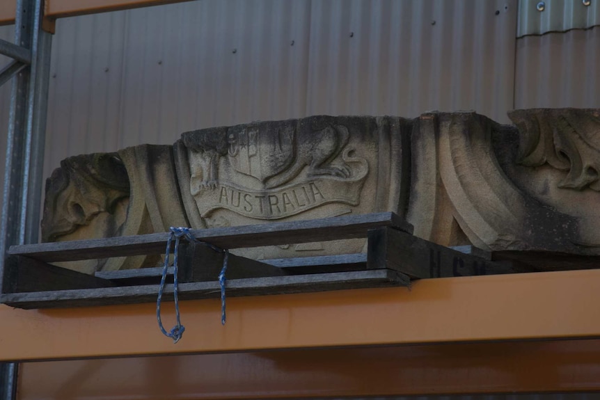 A sandstone block featuring the Australian emblems from Sydney Hospital