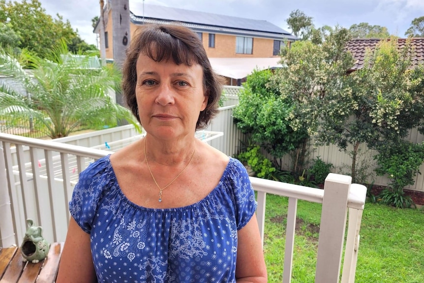 A woman in a blue top