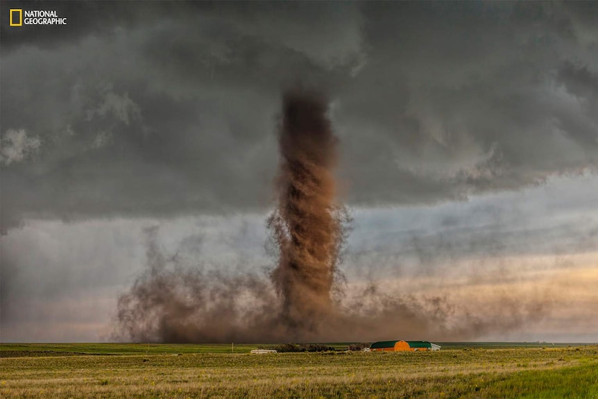 A tornado made brown by dirt.