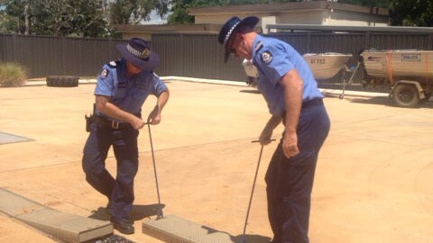 Kimberley police test a new device designed to destroy black market liquor in Fitzroy Crossing on March 10, 2014.