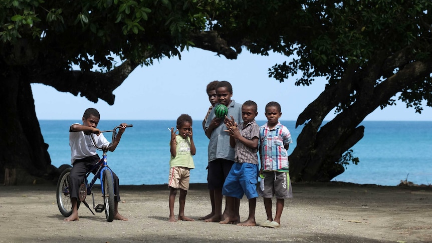 Children playing on the beach, Epi Island, Vanuatu.