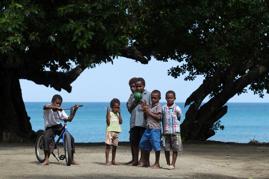 Children playing on the beach, Epi Island, Vanuatu.