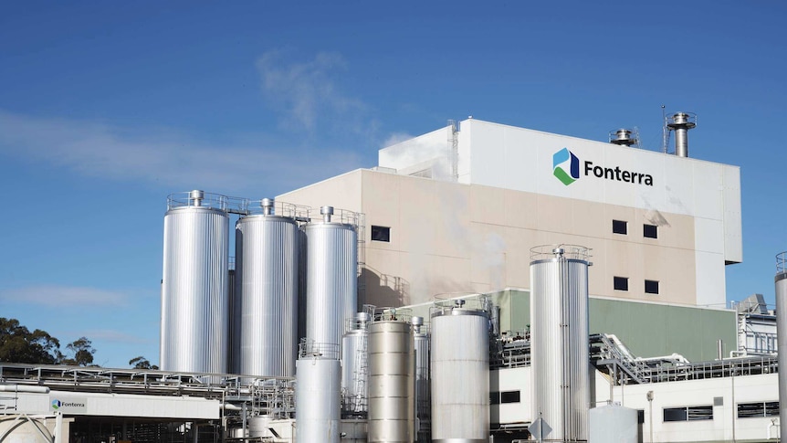 A milk processing plant with a Fonterra logo on the side