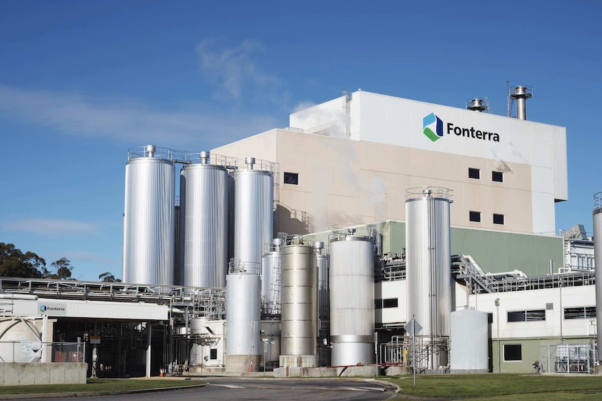 A milk processing plant with a Fonterra logo on the side