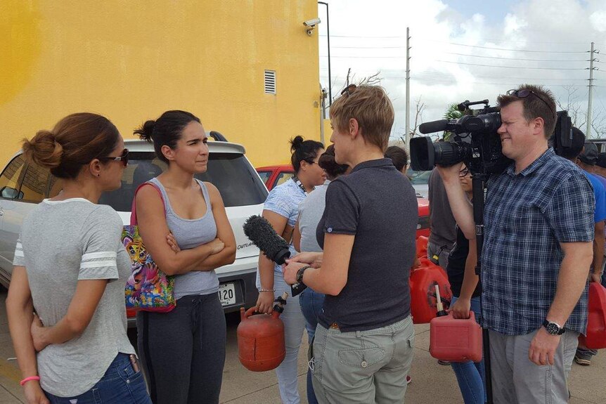 Zoe Daniel speaks to locals in Puerto Rico.