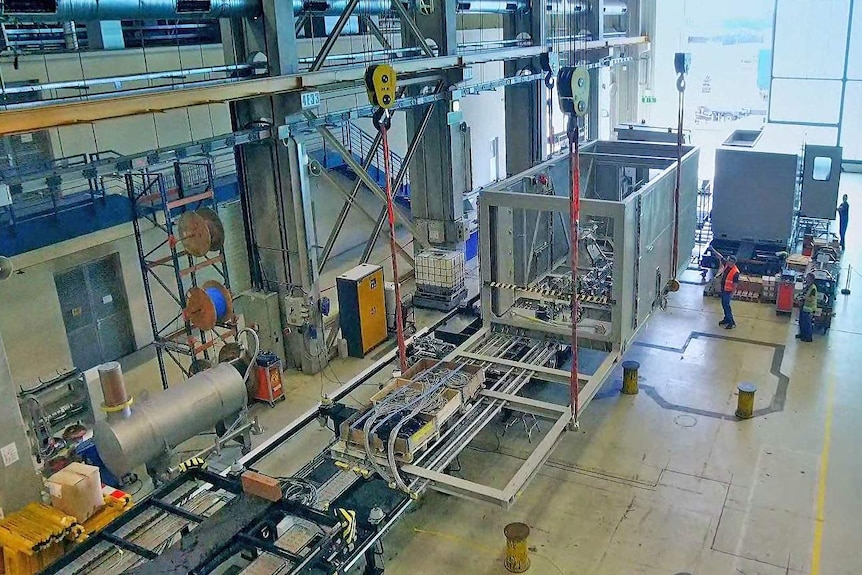 Aerial view of power generators under construction.