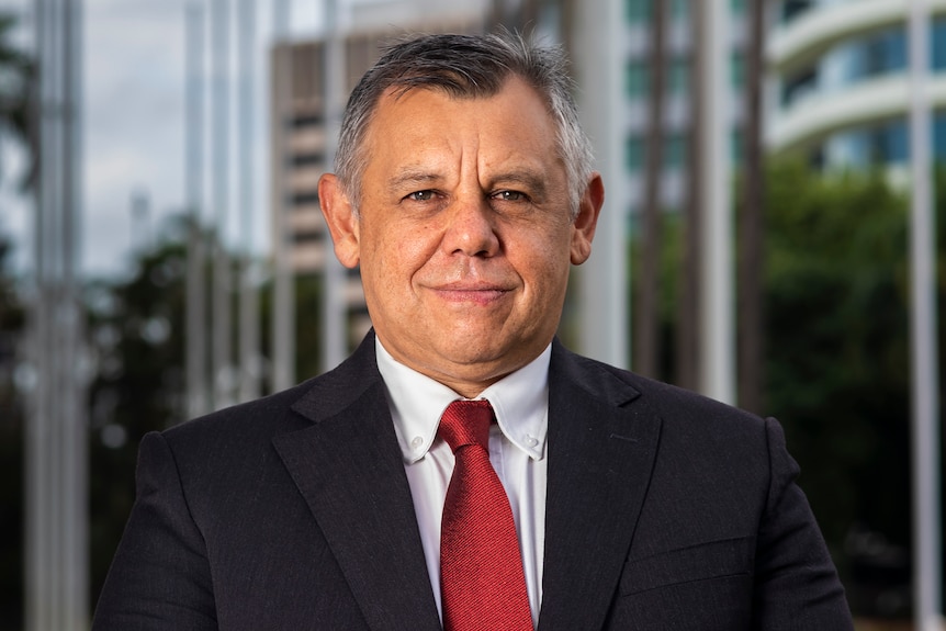 Headshot of man looking at camera