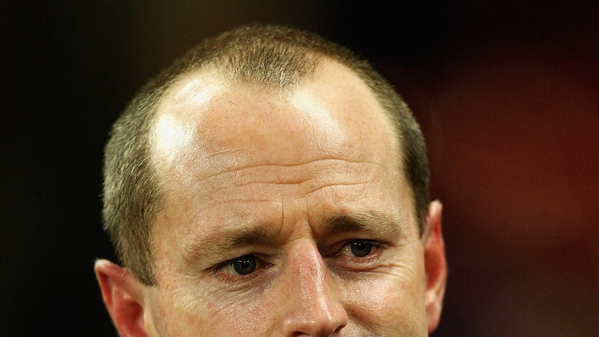John Sutton believes Michael Maguire's (pictured) signing on as coach can add some focus to the Rabbitohs.