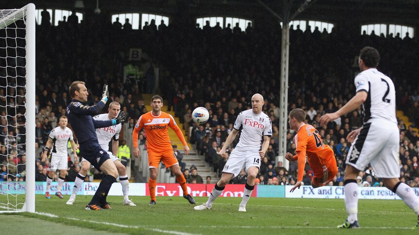 At the double ... Gylfi Sigurdsson scores the first of his two goals against Fulham