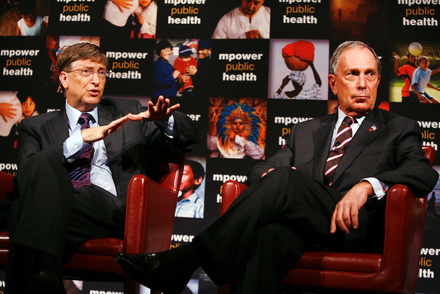 Microsoft Corp co-founder Bill Gates speaks as New York City Mayor Michael Bloomberg sits during a news conference