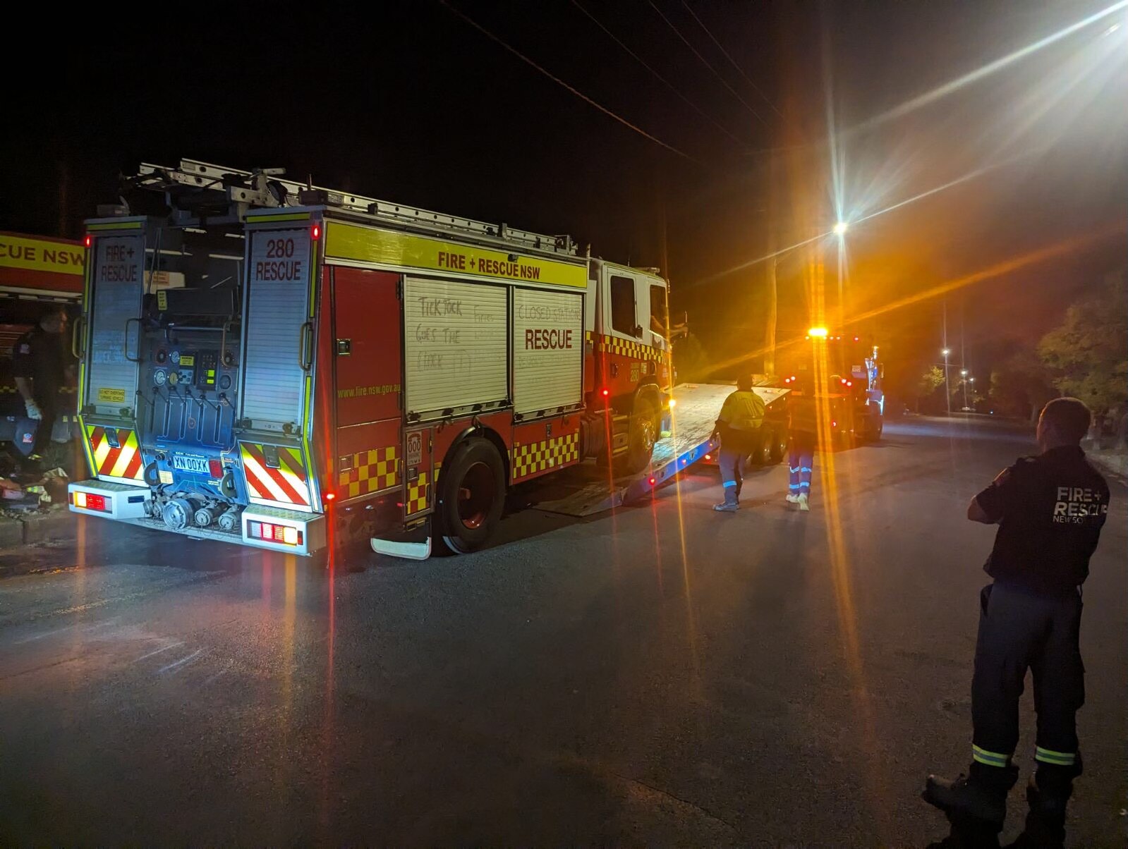 A truck is loaded onto a tow truck.