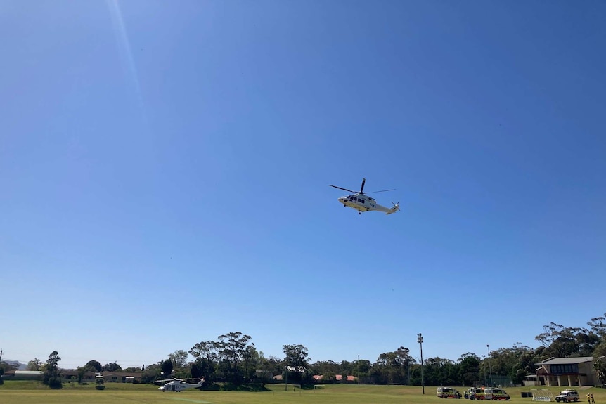 A helicopter takes off at Shoalhaven Heads after a fatal crash.