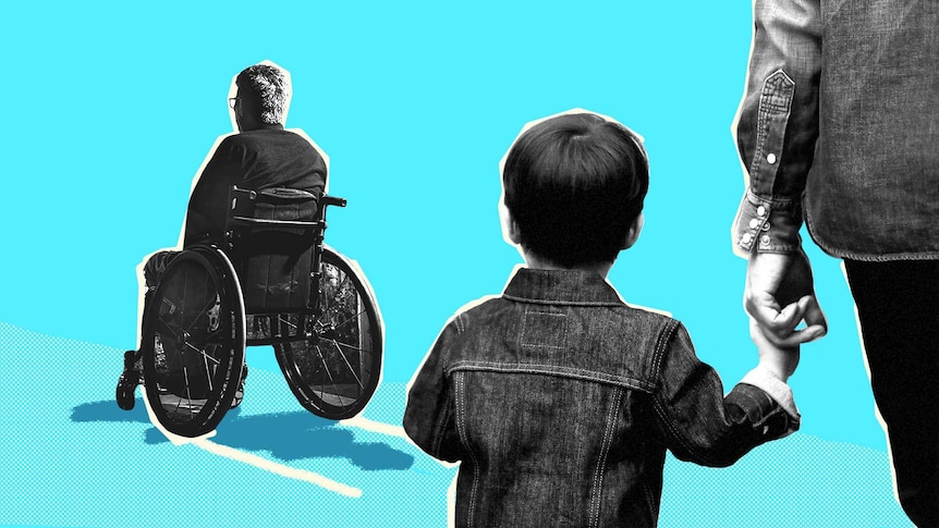 A young boy and an adult stare at a man in a wheelchair