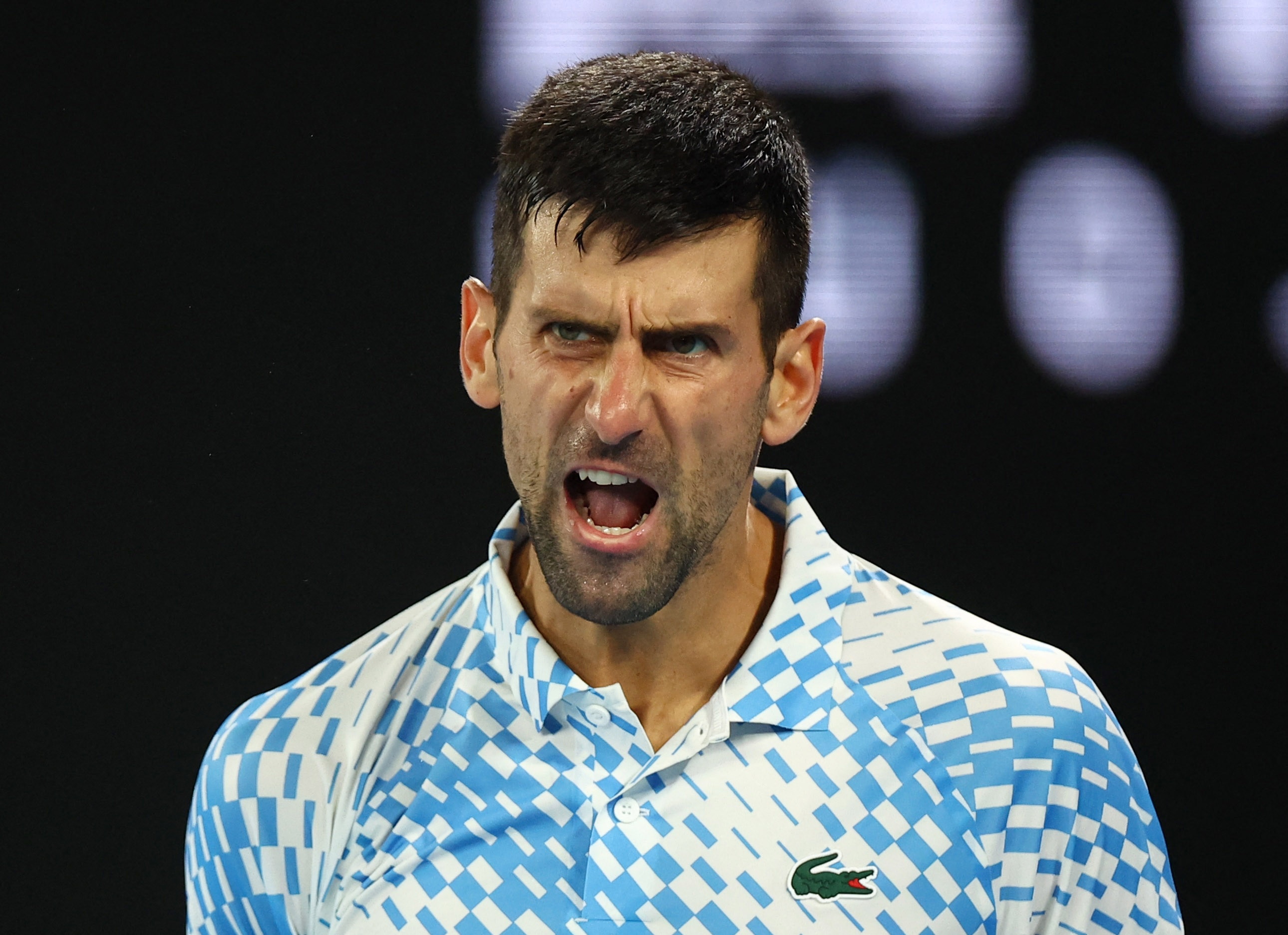 Novak Djokovic yells.