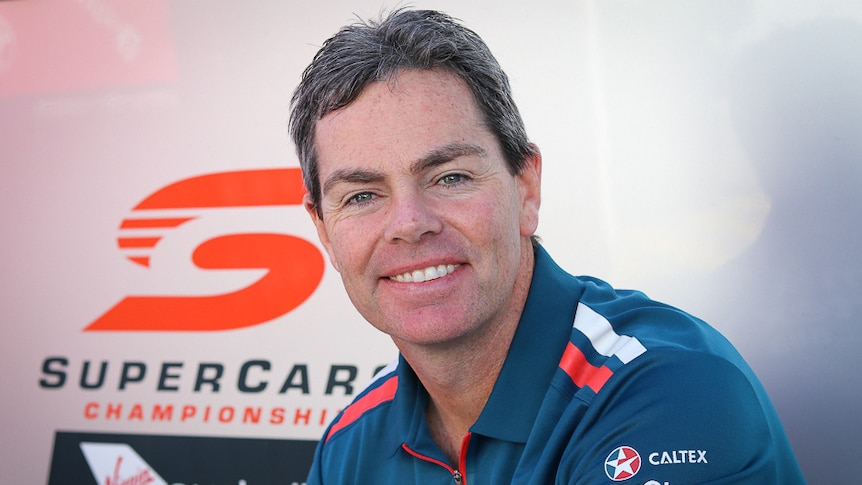 Mid-shot of racing car driver Craig Lowndes, smiling.